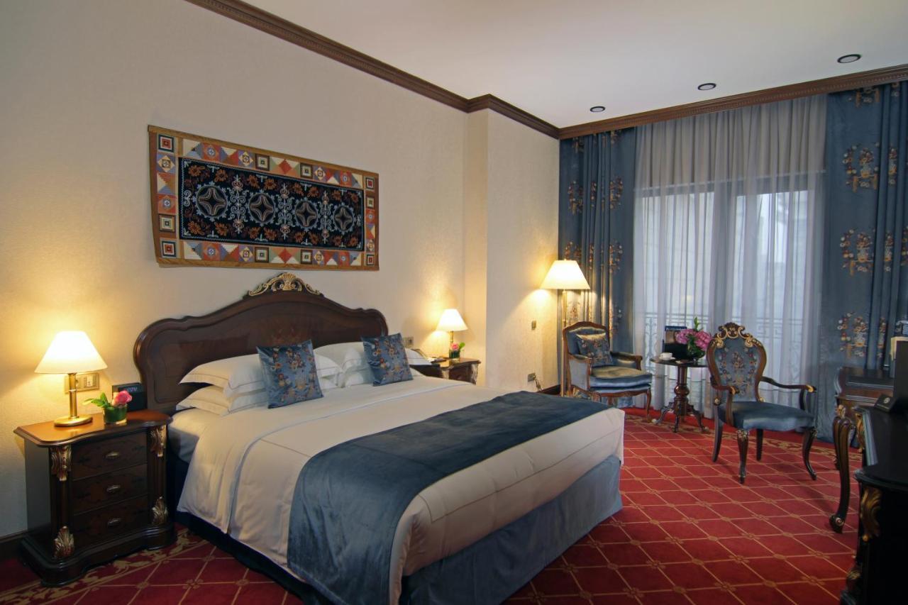 Orion Hotel Bischkek Exterior foto A room at the hotel