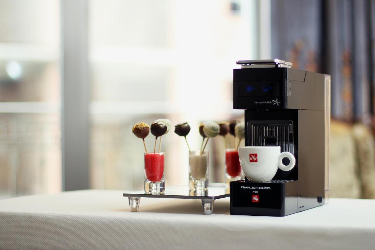 Orion Hotel Bischkek Exterior foto A Nespresso Vertuoline coffee machine