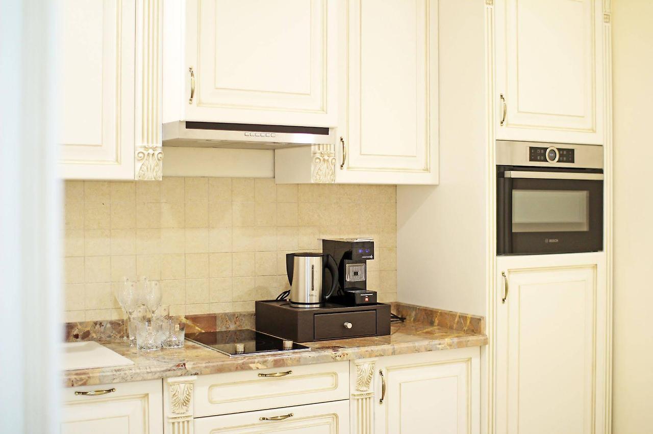 Orion Hotel Bischkek Exterior foto A coffee machine in a kitchen
